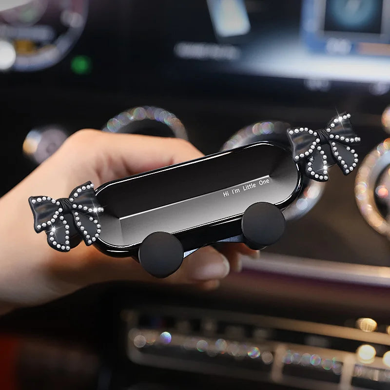 Cute Bowknot Universal Car Phone Holder Cartoon Diamond GPS Stand Gravity Bracket Auto Air Vent Clip Mount Mobile Phone Holder