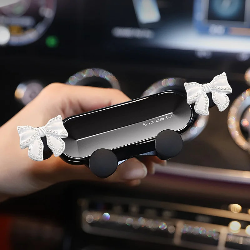 Cute Bowknot Universal Car Phone Holder Cartoon Diamond GPS Stand Gravity Bracket Auto Air Vent Clip Mount Mobile Phone Holder